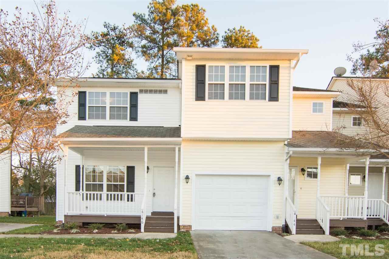 4146 Standing Rock Way Raleigh, NC 27604 - Photo 1 of 18 front view of a house with a yard