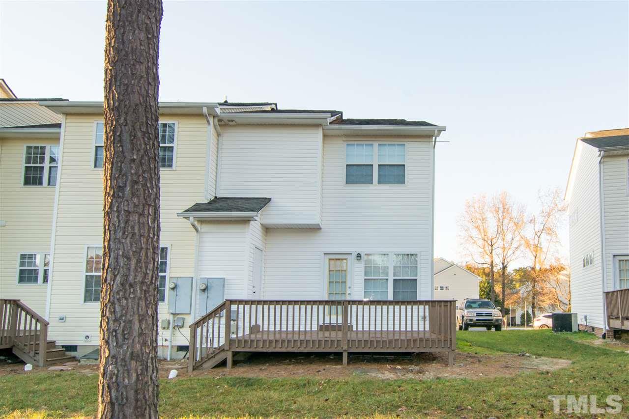 4146 Standing Rock Way Raleigh, NC 27604 - Photo 2 of 18 a view of a house with a deck and a yard