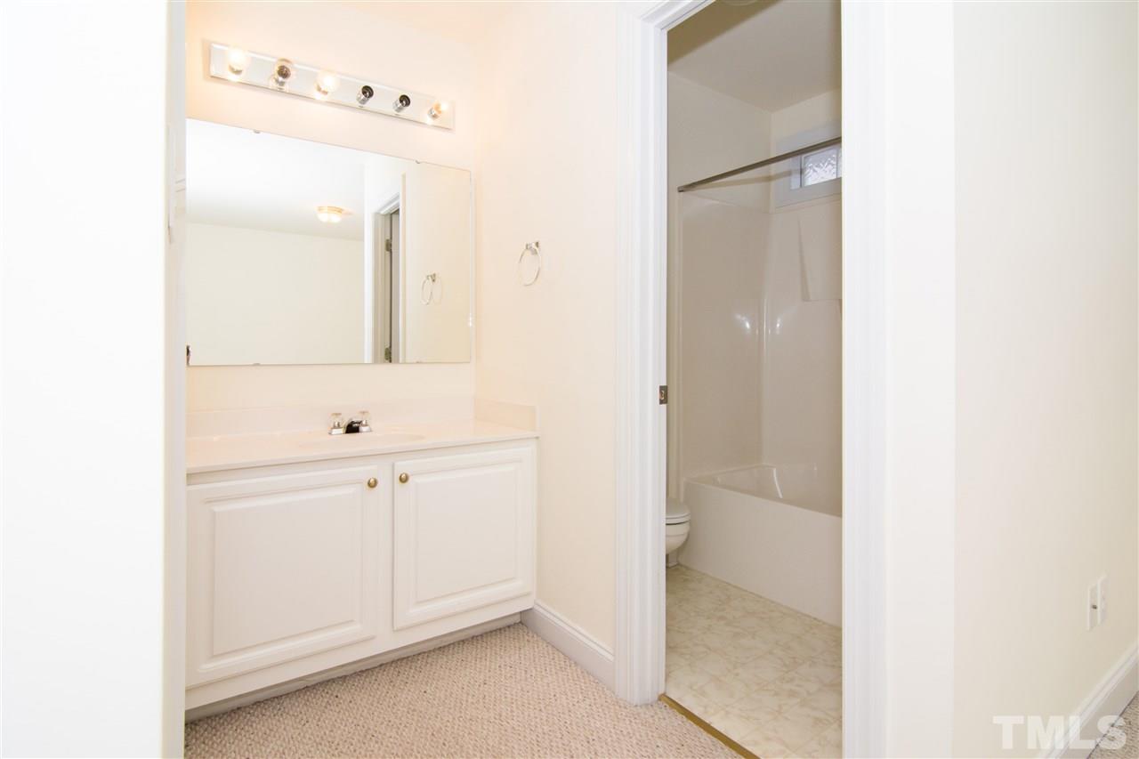 4146 Standing Rock Way Raleigh, NC 27604 - Photo 13 of 18 a bathroom with a double vanity sink and mirror