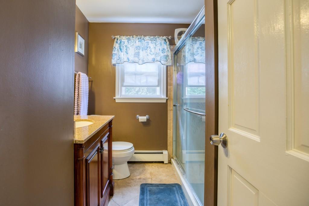 159 Fair Oak Road Springfield, MA 01128 - Photo 12 of 21 a bathroom with a toilet a sink and a mirror