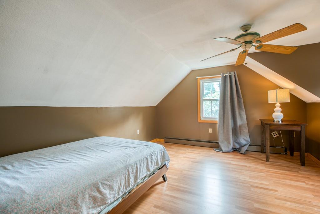 159 Fair Oak Road Springfield, MA 01128 - Photo 15 of 21 a bedroom with a bed and wooden floor