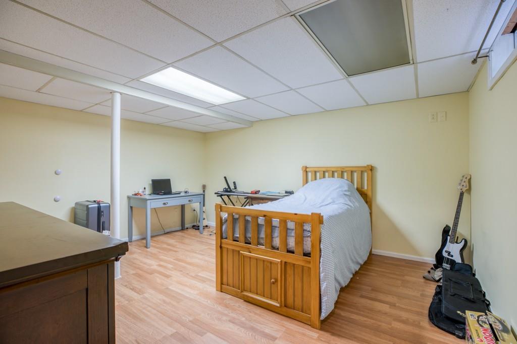 159 Fair Oak Road Springfield, MA 01128 - Photo 19 of 21 a bedroom with a bed and wooden floor
