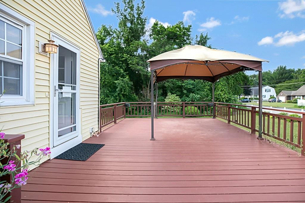 159 Fair Oak Road Springfield, MA 01128 - Photo 3 of 21 a view of a deck with wooden floor and umbrella