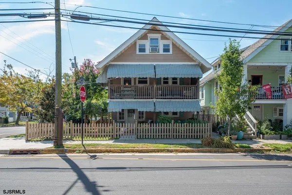 a front view of a house with a porch