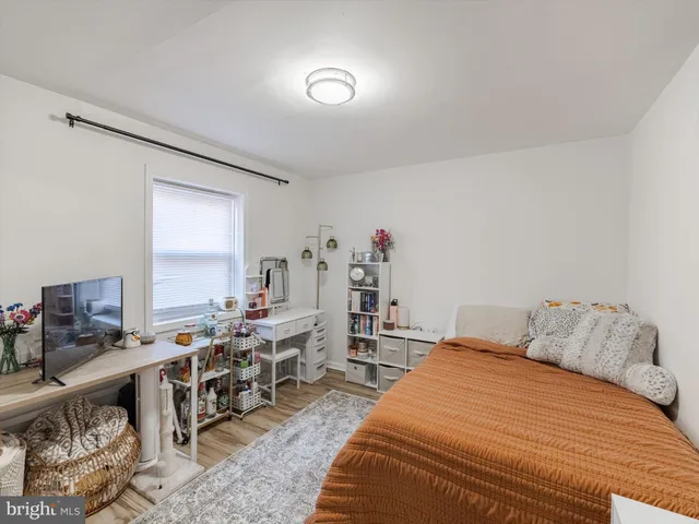 a bathroom with a sink mirror vanity and toilet