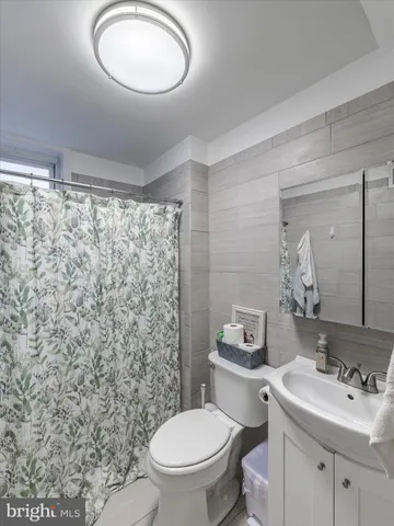 a kitchen with cabinets appliances a sink and a counter top space