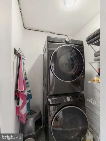 a bedroom with a bed and a potted plant