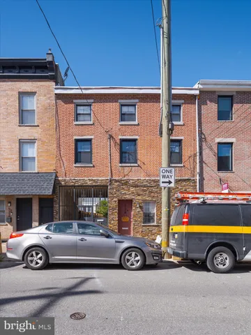 a front view of a house with glass windows