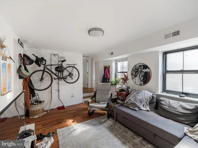 a bedroom with a workspace