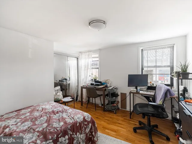 a bathroom with a sink vanity mirror and toilet