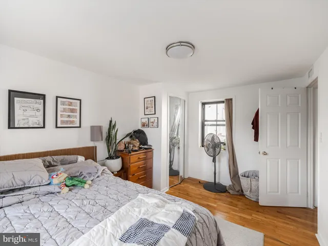 a kitchen with a refrigerator a stove top oven a sink and a island