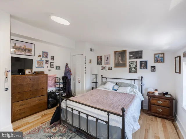 a view of a workspace with furniture and wooden floor