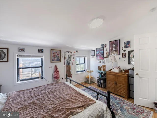 a bedroom with a bed and a cabinets