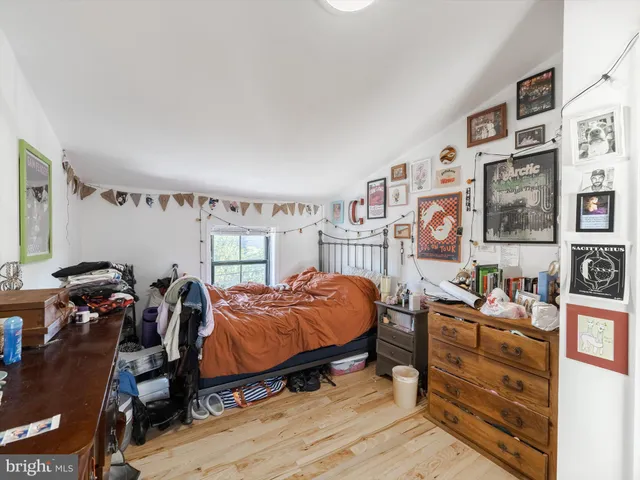 a car parked in front of a brick house