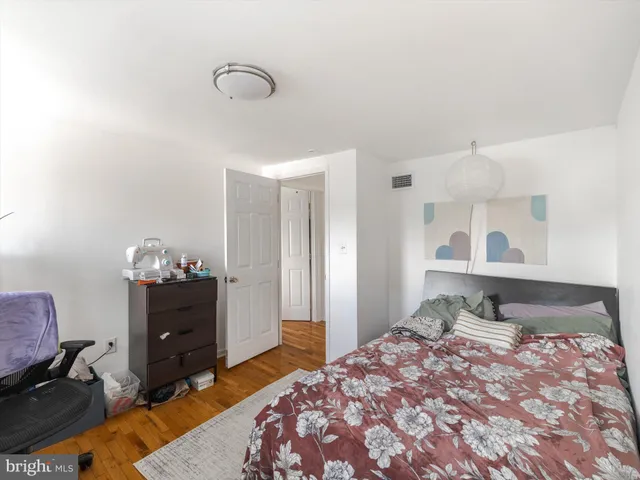 a front view of a building with a red door