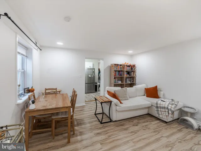 a bedroom with furniture and a flat screen tv
