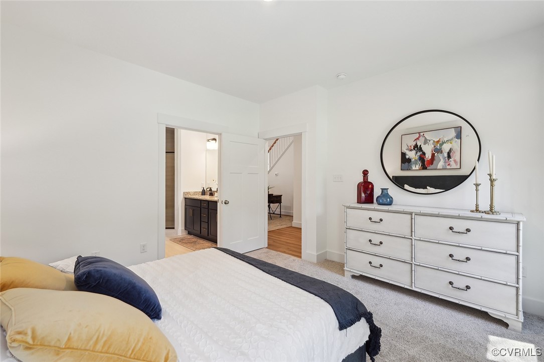 7600 Oak Grove Tree Drive Chesterfield, VA 23832 - Photo 15 of 17 a bedroom with a bed and a dresser
