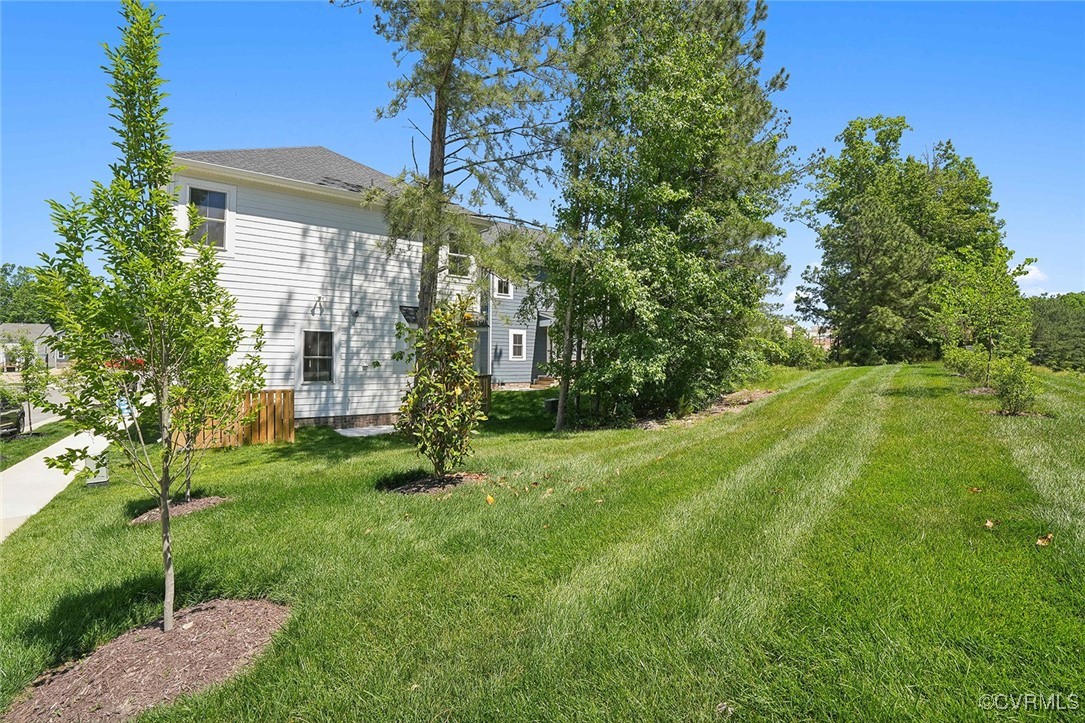 7600 Oak Grove Tree Drive Chesterfield, VA 23832 - Photo 17 of 17 a view of a big yard in front of a house
