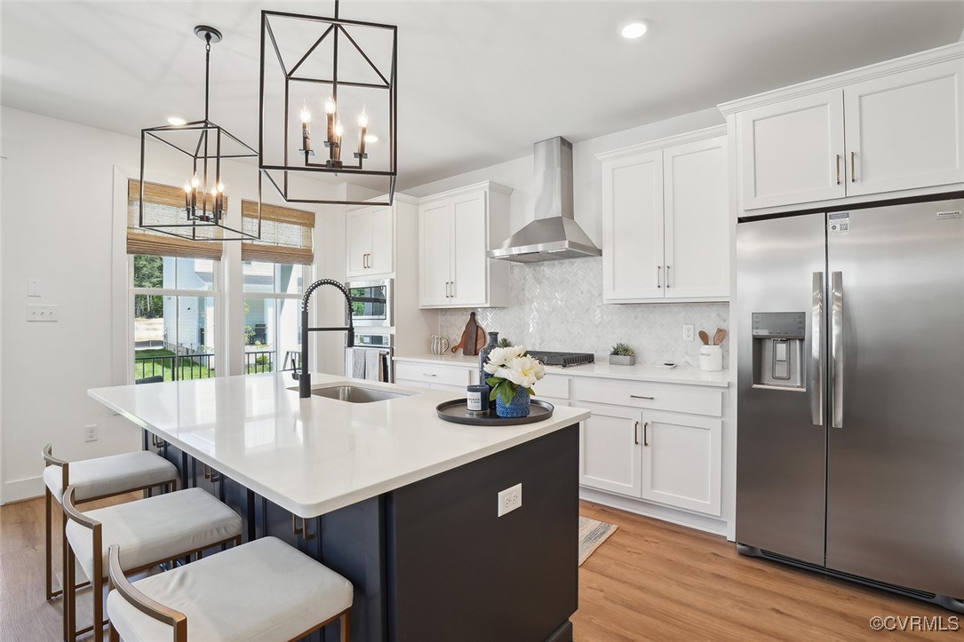 7600 Oak Grove Tree Drive Chesterfield, VA 23832 - Photo 3 of 17 a kitchen with stainless steel appliances a sink a stove a refrigerator and cabinets