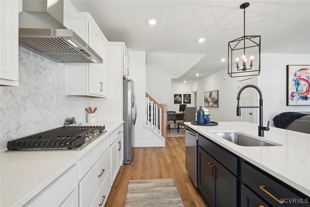 7600 Oak Grove Tree Drive Chesterfield, VA 23832 - Photo 8 of 17 a kitchen with sink stove and cabinets