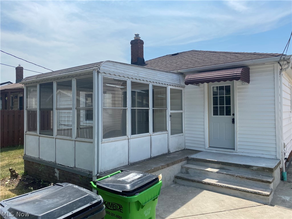 13117 Silver Road Garfield Heights, OH 44125 - Photo 3 of 20 Back of house with a sunroom