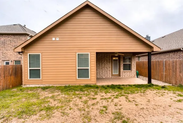 a front view of a house with a patio