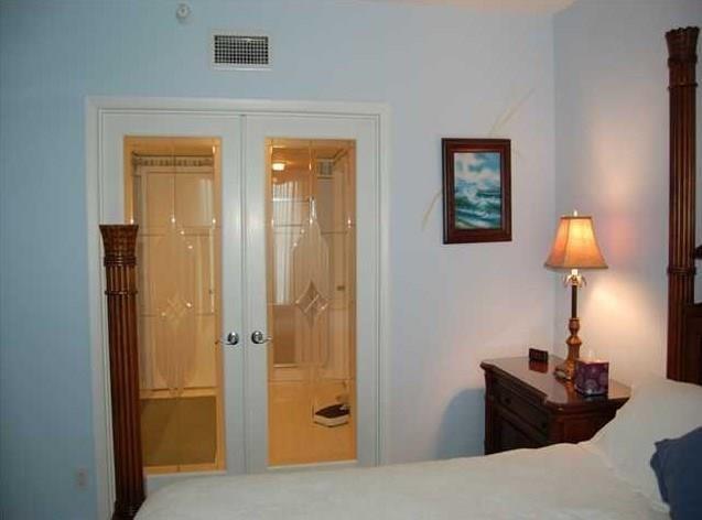 579 Northeast Plantation Road, Unit S407 Jensen Beach, FL 34957 - Photo 23 of 44 Doors to Master Bath
