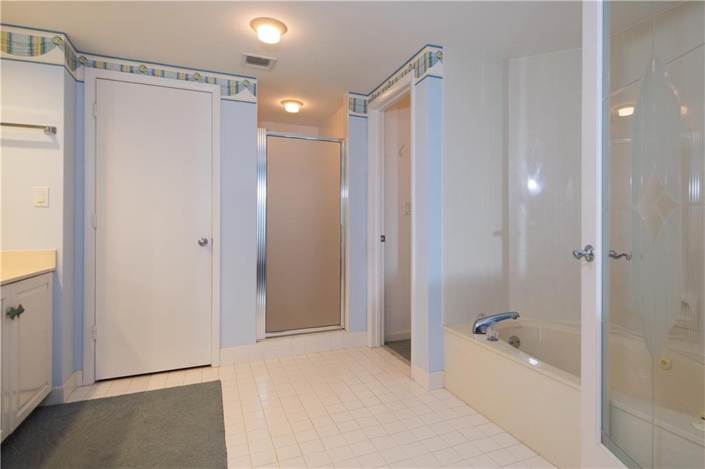 579 Northeast Plantation Road, Unit S407 Jensen Beach, FL 34957 - Photo 25 of 44 Shower & Walk-in Closet