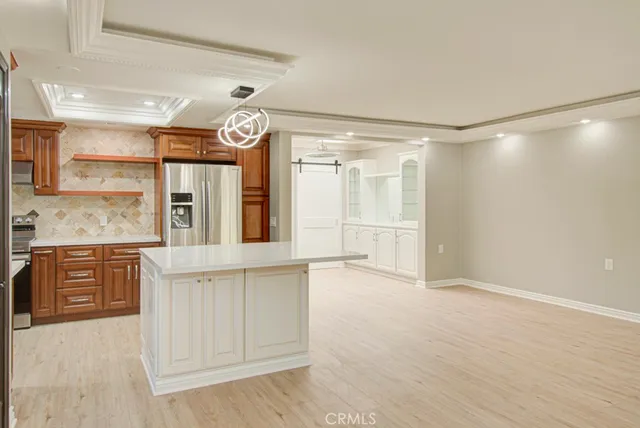 a spacious bathroom with a granite countertop sink mirror and a shower