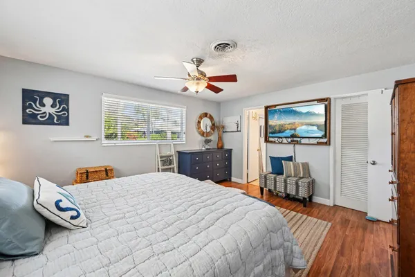 a bedroom with furniture and a rug