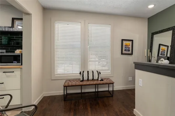 a view of a livingroom with furniture and windows