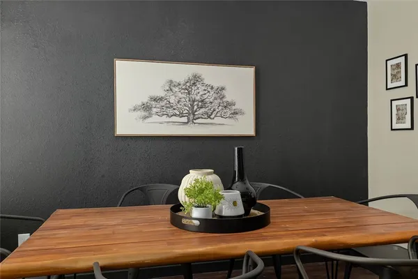a table with a vase and flowers on it