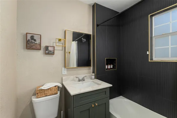 a bathroom with a sink toilet and vanity