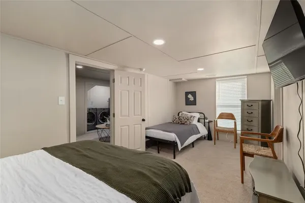 a bedroom with a bed and a couch