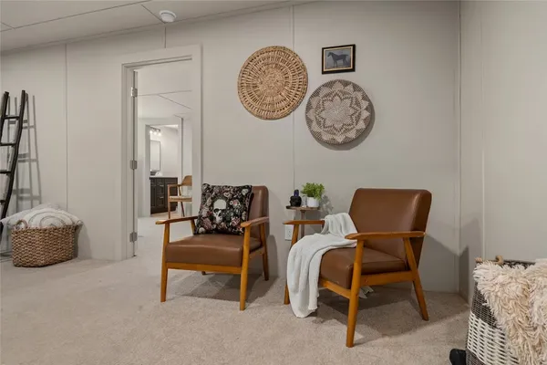 a view of a livingroom with furniture and a chair