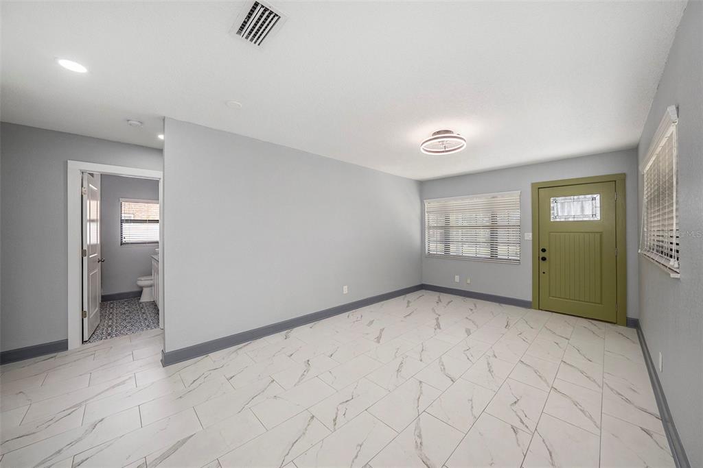 1713 West St Isabel Street Tampa, FL 33607 - Photo 4 of 25 an empty room with windows