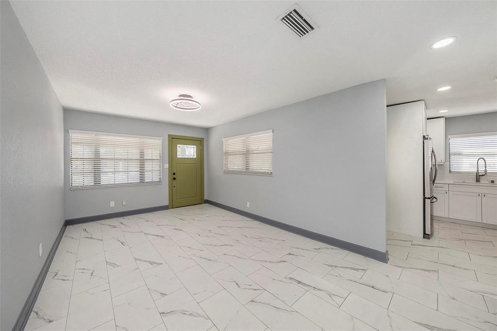 1713 West St Isabel Street Tampa, FL 33607 - Photo 5 of 25 a view of an empty room with a window