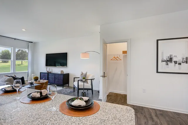 a bedroom with a bed and a mirror