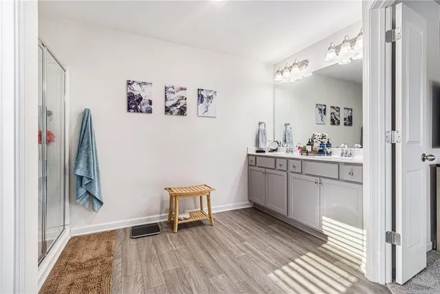 a kitchen with granite countertop a refrigerator and a sink