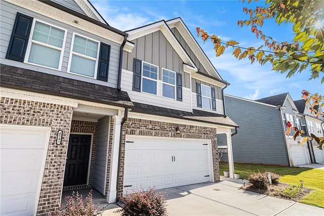a front view of a house with a garage