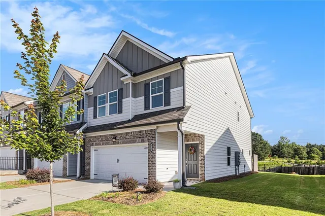 a front view of a house with a yard