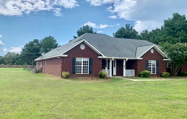 a view of a house with a yard