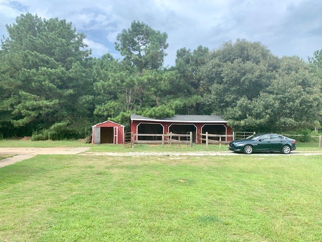 92 McLendon Road Fort Mitchell, AL 36856 - Photo 15 of 16 a front view of house with yard and trees