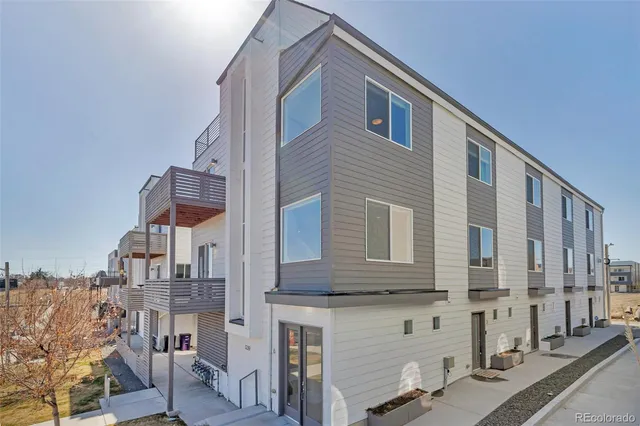 a front view of a building with many windows