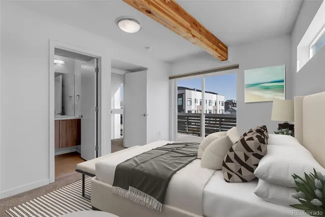 a bedroom with a bed and a couch