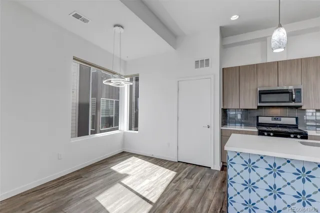 a kitchen with sink cabinets and window