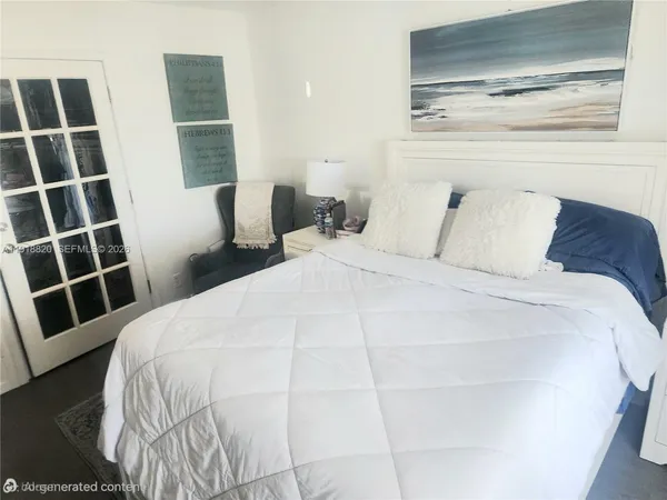 a large white bed in a white room