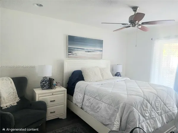 a bedroom with a bed and ceiling fan
