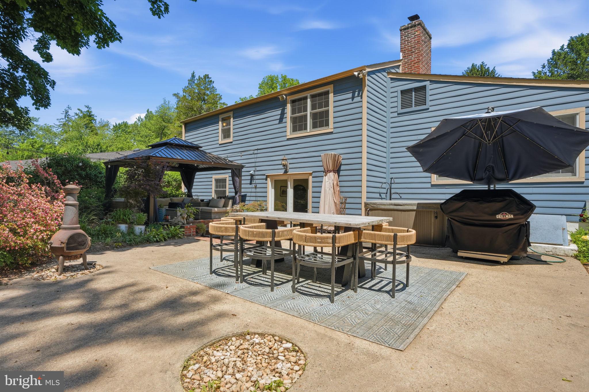 621 River Road Yardley, PA 19067 - Photo 58 of 75 a view of a patio with table and chairs under an umbrella