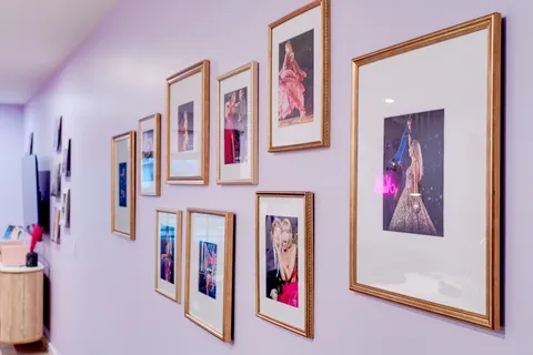 a living room with furniture a couch and a large window